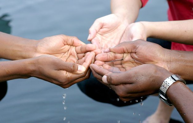 Hands catching water